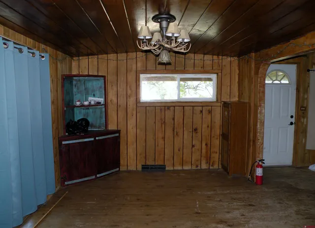 a view of an entryway with a chandelier