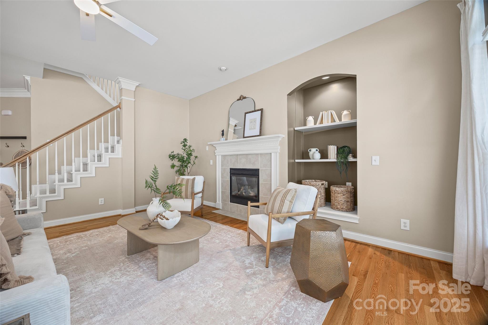 3272 Richard's Crossing Fort Mill, SC 29708 - Photo 12 of 33 a living room with furniture a fireplace and a dining table with wooden floor