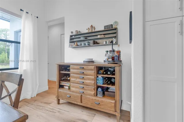 a bathroom with a tub a sink and mirror
