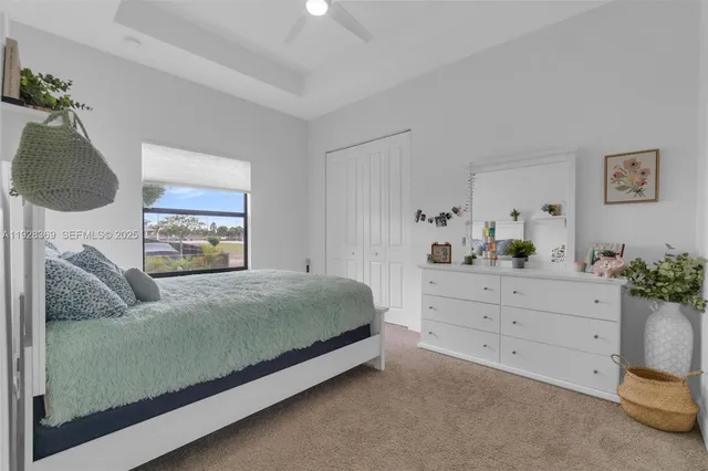 a bedroom with a bed and a bookshelf