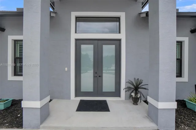 a view of a livingroom with furniture and wooden floor