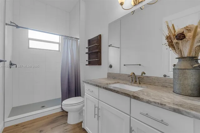 a view of a house with a backyard porch and sitting area