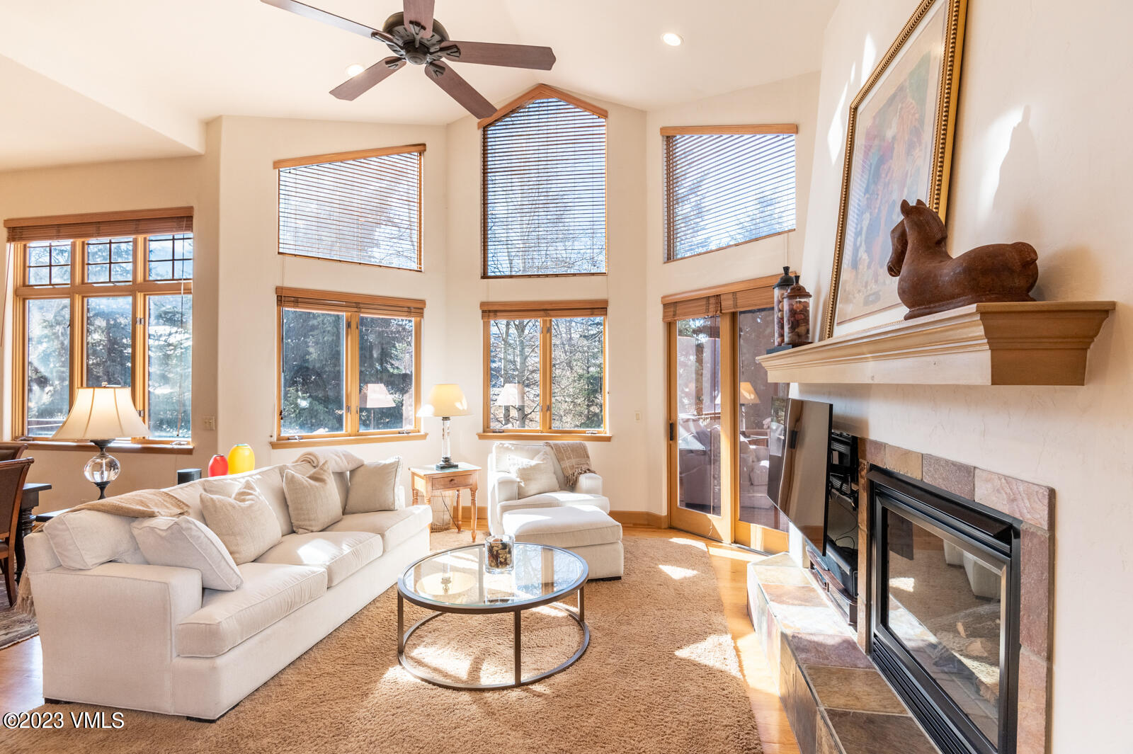 306 Hackamore Road, Unit A Edwards, CO 81632 - Photo 6 of 27 a living room with furniture a fireplace and a large window