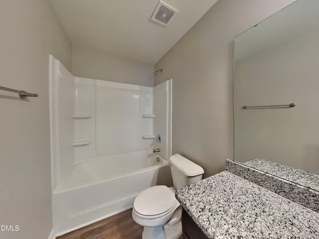 a bathroom with a sink a toilet and a bathtub