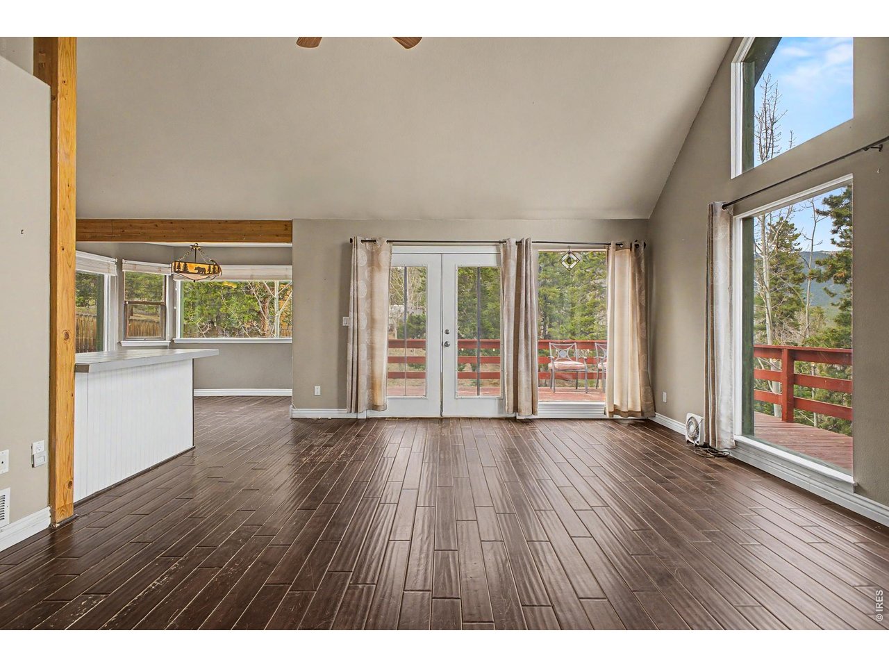 76 Highlands Drive Bailey, CO 80421 - Photo 18 of 49 an empty room with wooden floor and windows