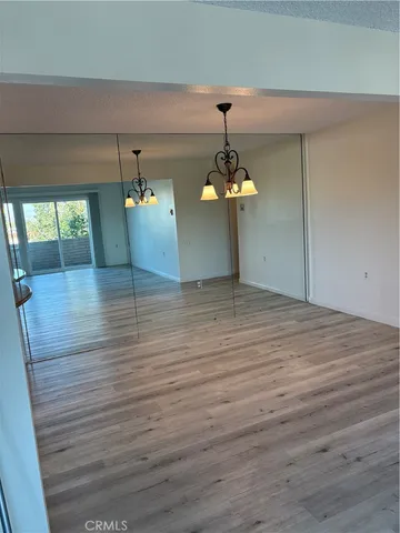 a view of a room with a wooden floor