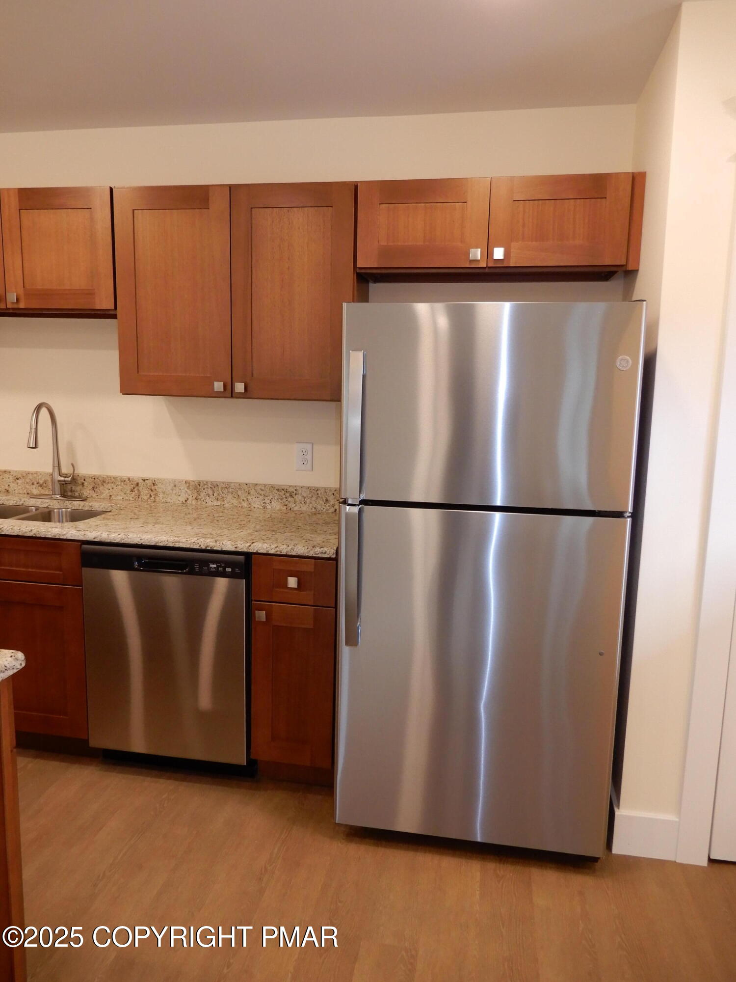 101 Brook Village Scotrun, PA 18355 - Photo 11 of 18 a kitchen with a refrigerator and a sink