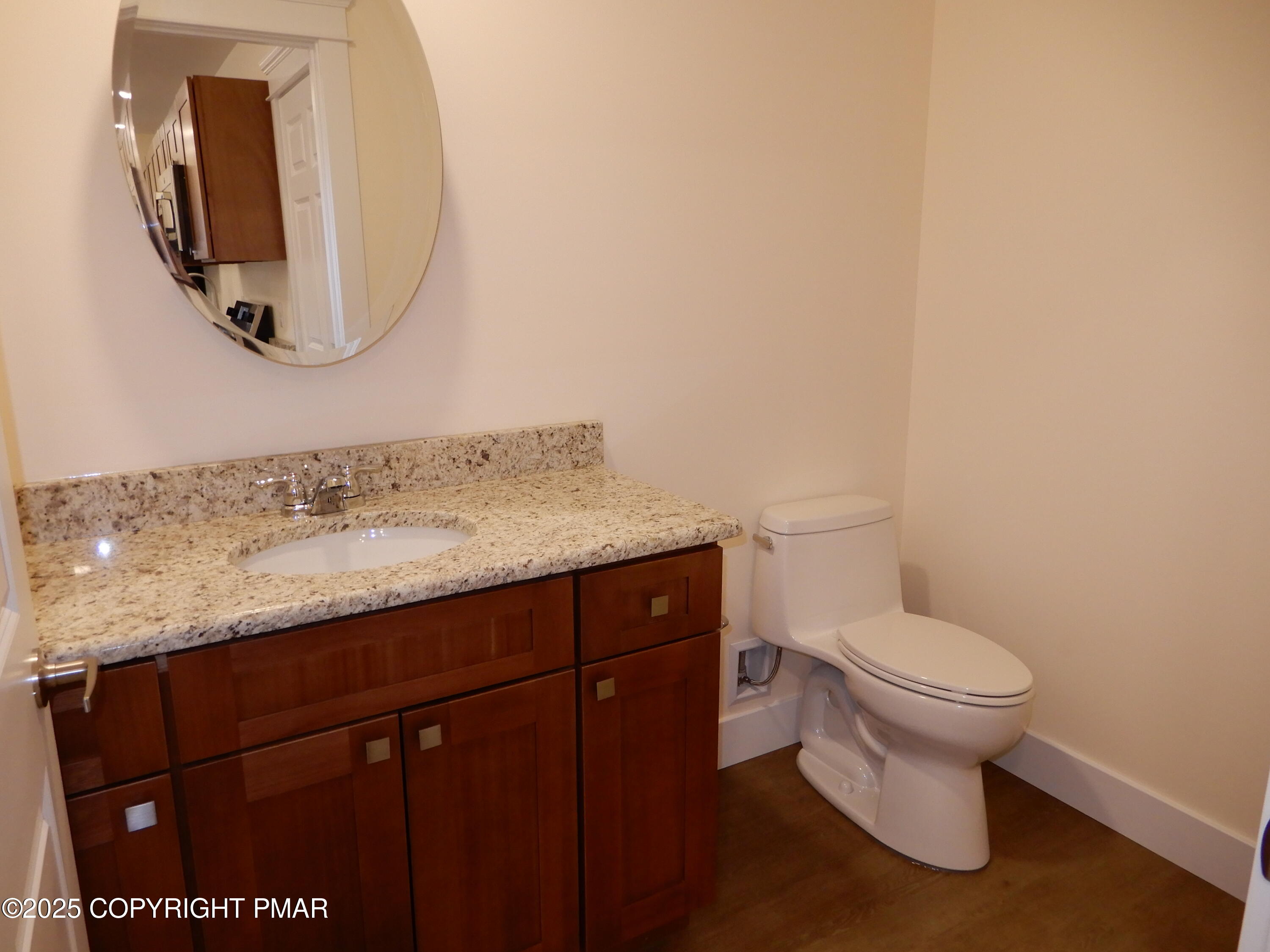 101 Brook Village Scotrun, PA 18355 - Photo 17 of 18 a bathroom with a granite countertop toilet sink and mirror