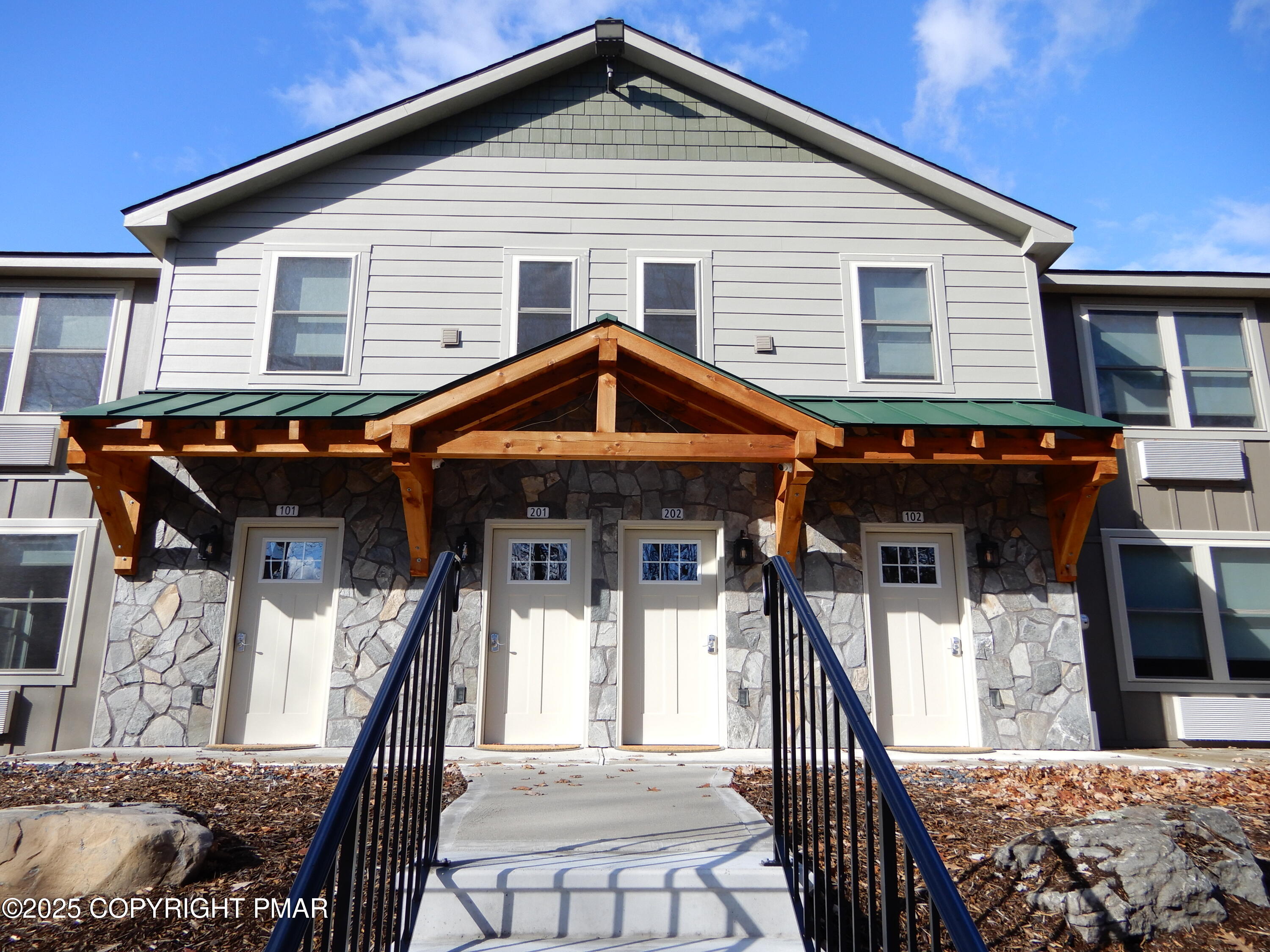 101 Brook Village Scotrun, PA 18355 - Photo 3 of 18 a front view of a house with parking