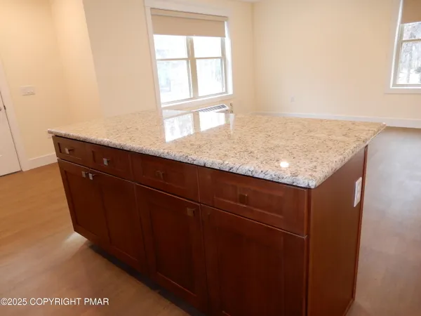 a stove top oven sitting inside of a kitchen