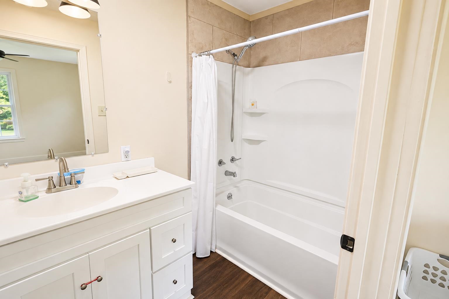 3226 19th Highway West Ripley, TN 38063 - Photo 10 of 18 Bright, updated bathroom featuring a white vanity with ample storage, ceramic countertop, and chrome fixtures