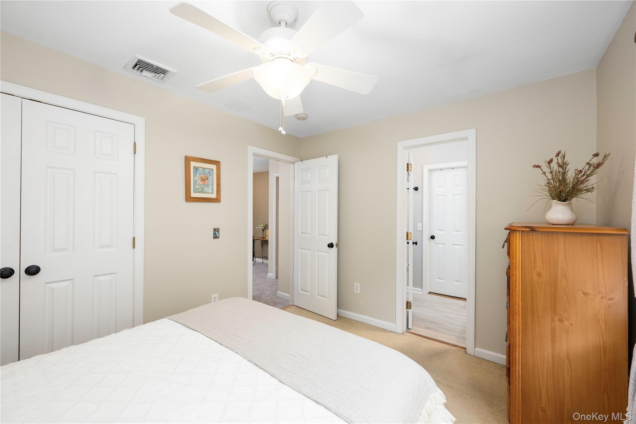 129 Stringham Road, Unit 31 LaGrangeville, NY 12540 - Photo 15 of 26 a bedroom with a bed and a chandelier
