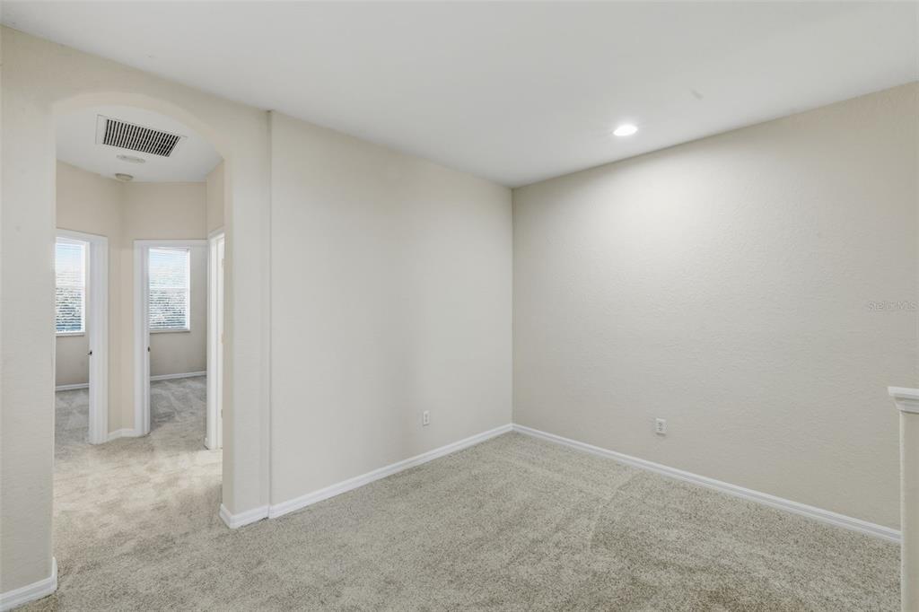 3914 Silverlake Way Wesley Chapel, FL 33544 - Photo 13 of 38 an empty room with entrance door