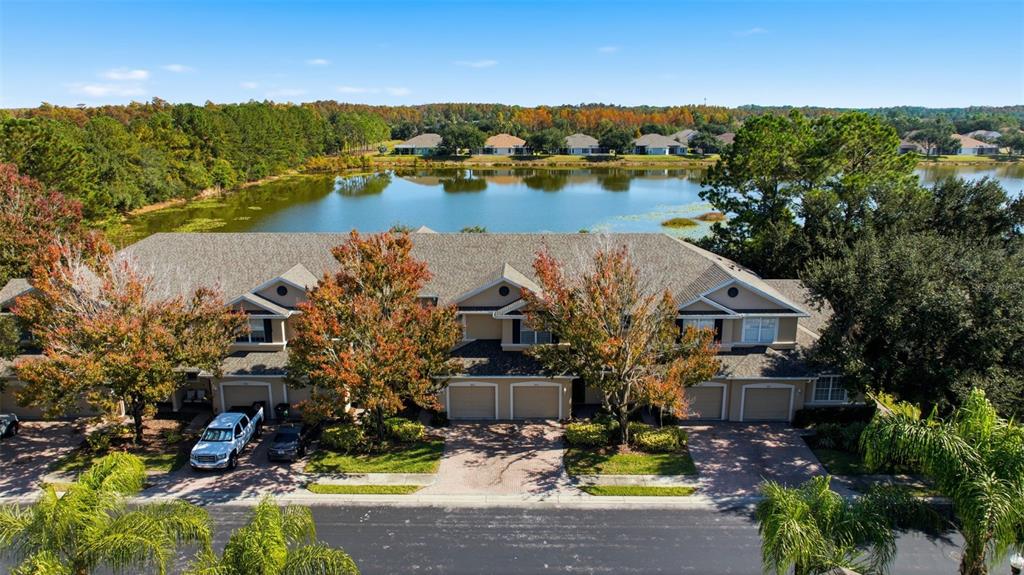 3914 Silverlake Way Wesley Chapel, FL 33544 - Photo 28 of 38 an aerial view of a house with a lake view
