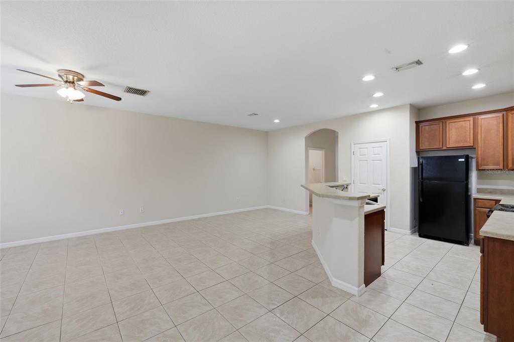 3914 Silverlake Way Wesley Chapel, FL 33544 - Photo 5 of 38 a view of kitchen with refrigerator and cabinets
