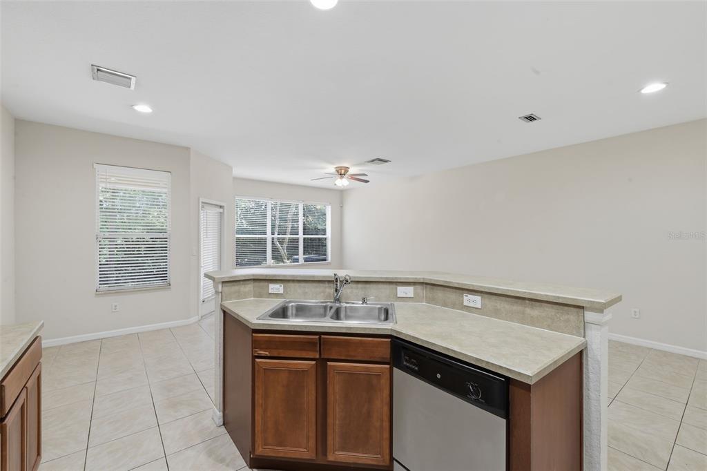 3914 Silverlake Way Wesley Chapel, FL 33544 - Photo 8 of 38 a kitchen with a sink and a window
