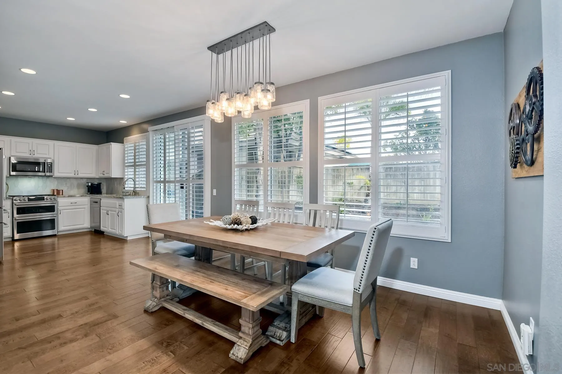 1145 Monterey Place Encinitas, CA 92024 - Photo 12 of 34 a dining room with furniture a chandelier and wooden floor