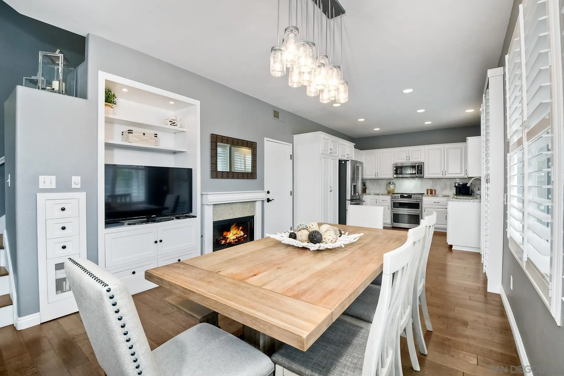 1145 Monterey Place Encinitas, CA 92024 - Photo 14 of 34 a view of a dining room with furniture a chandelier and wooden floor