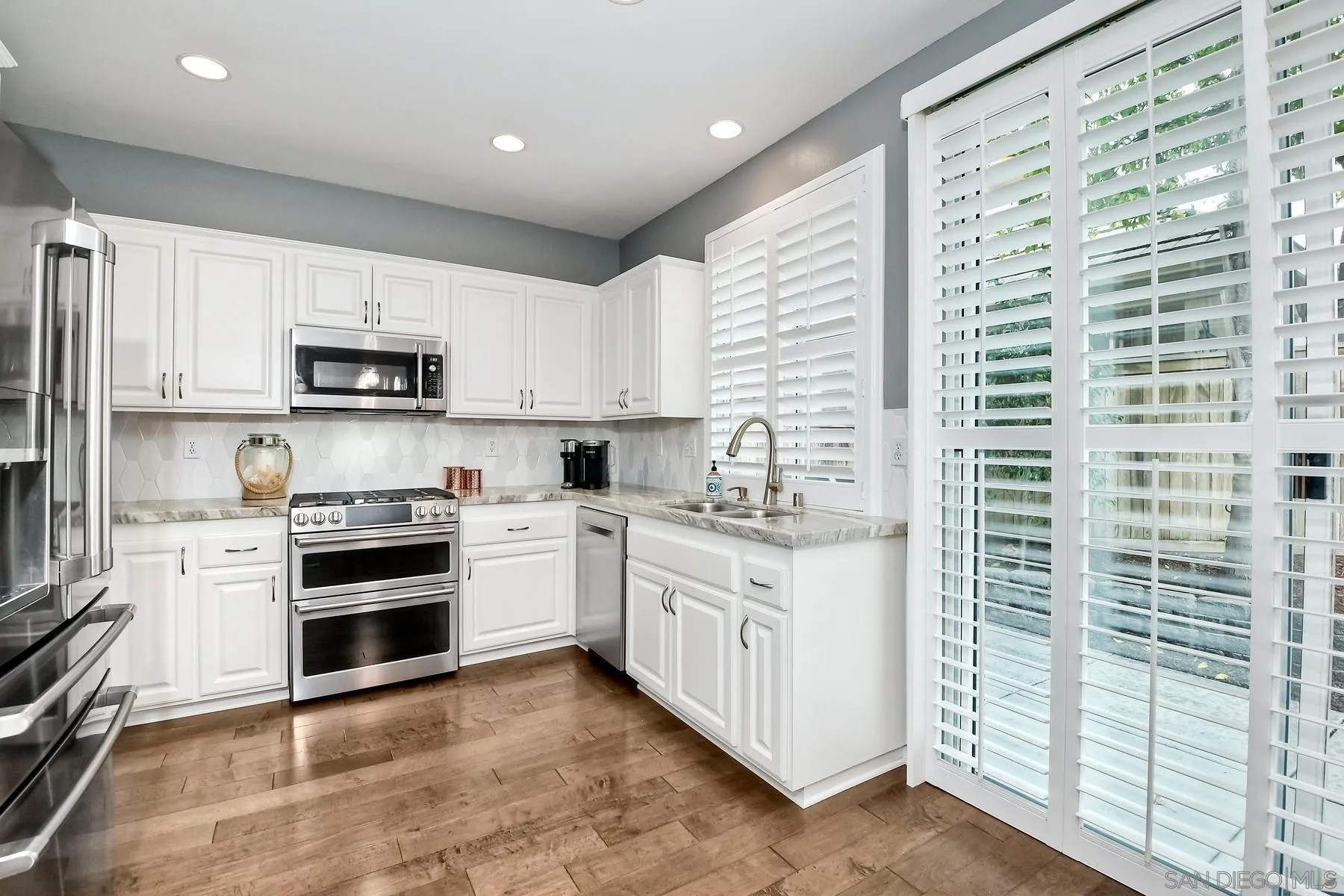 1145 Monterey Place Encinitas, CA 92024 - Photo 16 of 34 a kitchen with stainless steel appliances granite countertop a stove and a sink