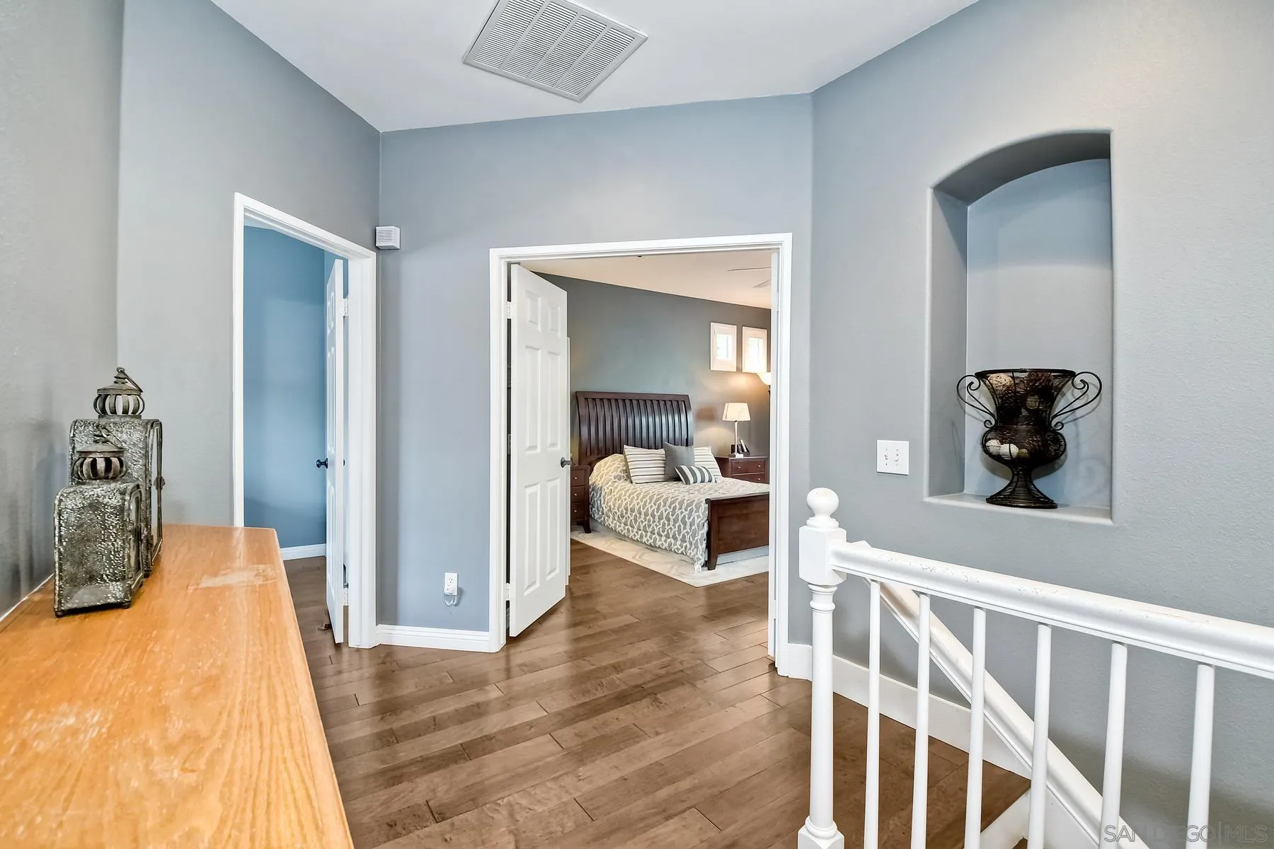 1145 Monterey Place Encinitas, CA 92024 - Photo 19 of 34 a bedroom with a bed and a large mirror