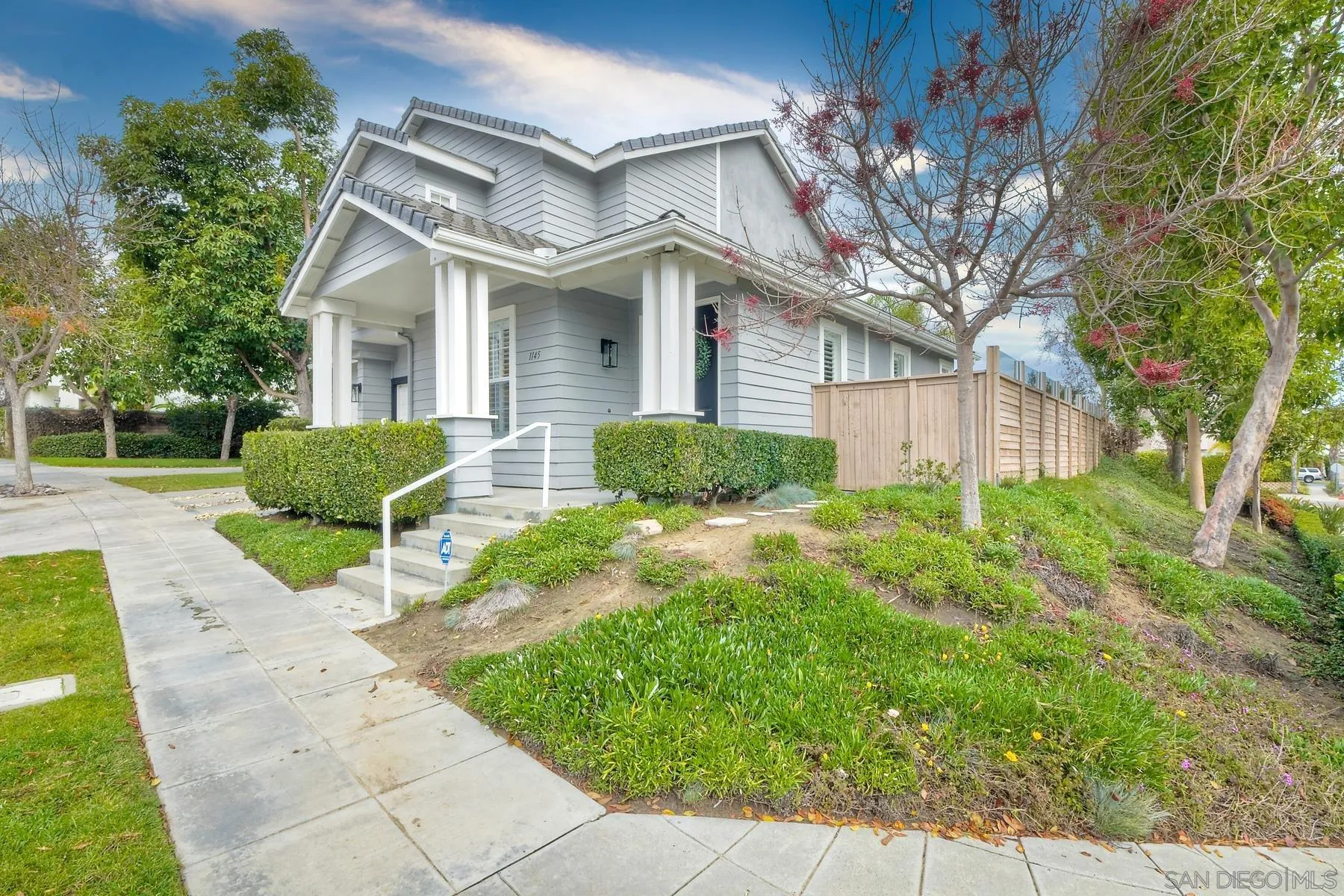 1145 Monterey Place Encinitas, CA 92024 - Photo 2 of 34 a view of a house with a small yard and a large tree