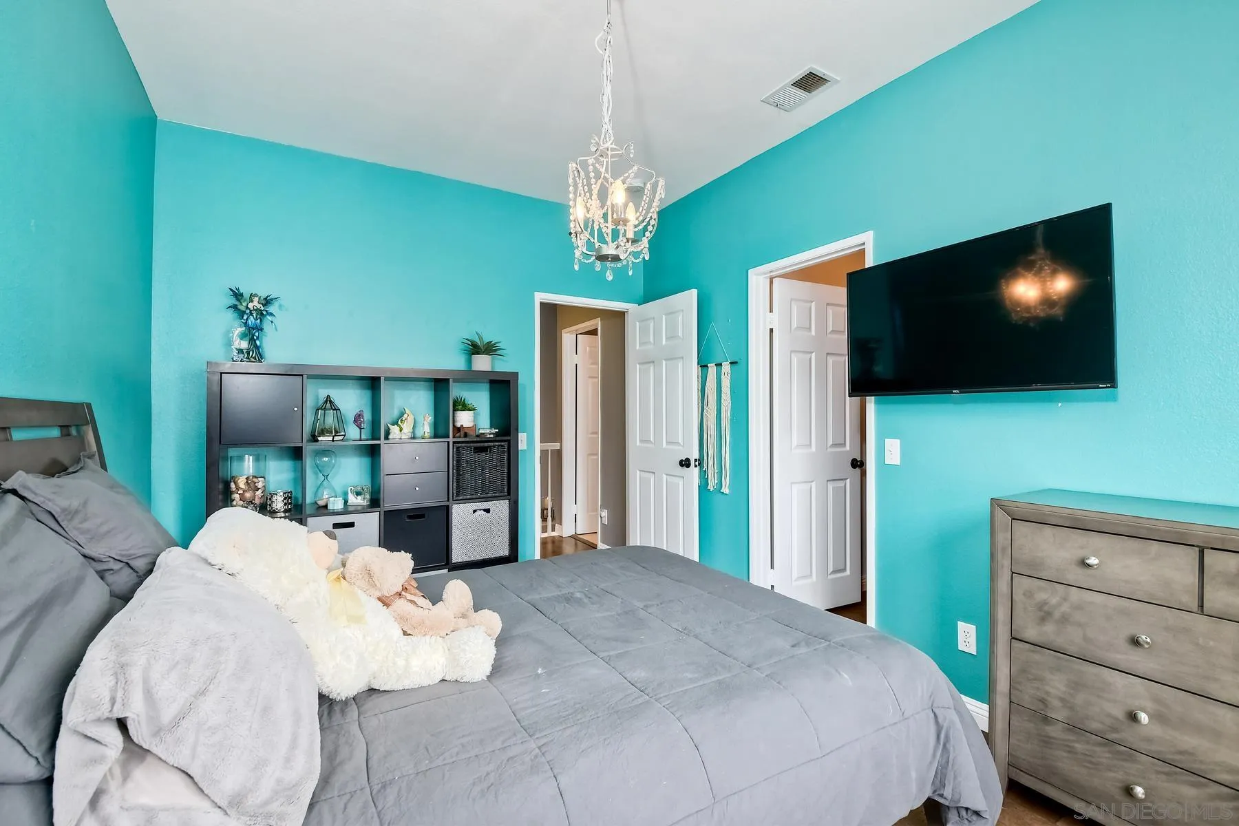 1145 Monterey Place Encinitas, CA 92024 - Photo 21 of 34 a bedroom with a bed and a flat screen tv