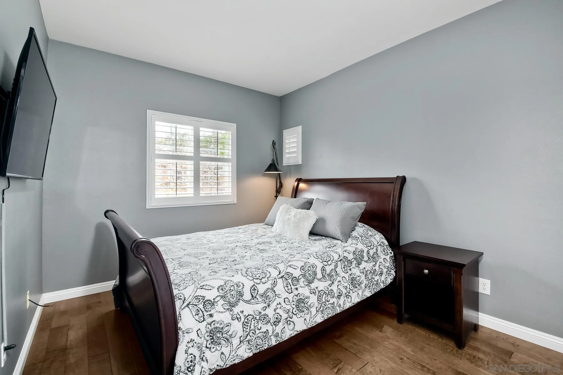 1145 Monterey Place Encinitas, CA 92024 - Photo 23 of 34 a bedroom with a bed and wooden floor