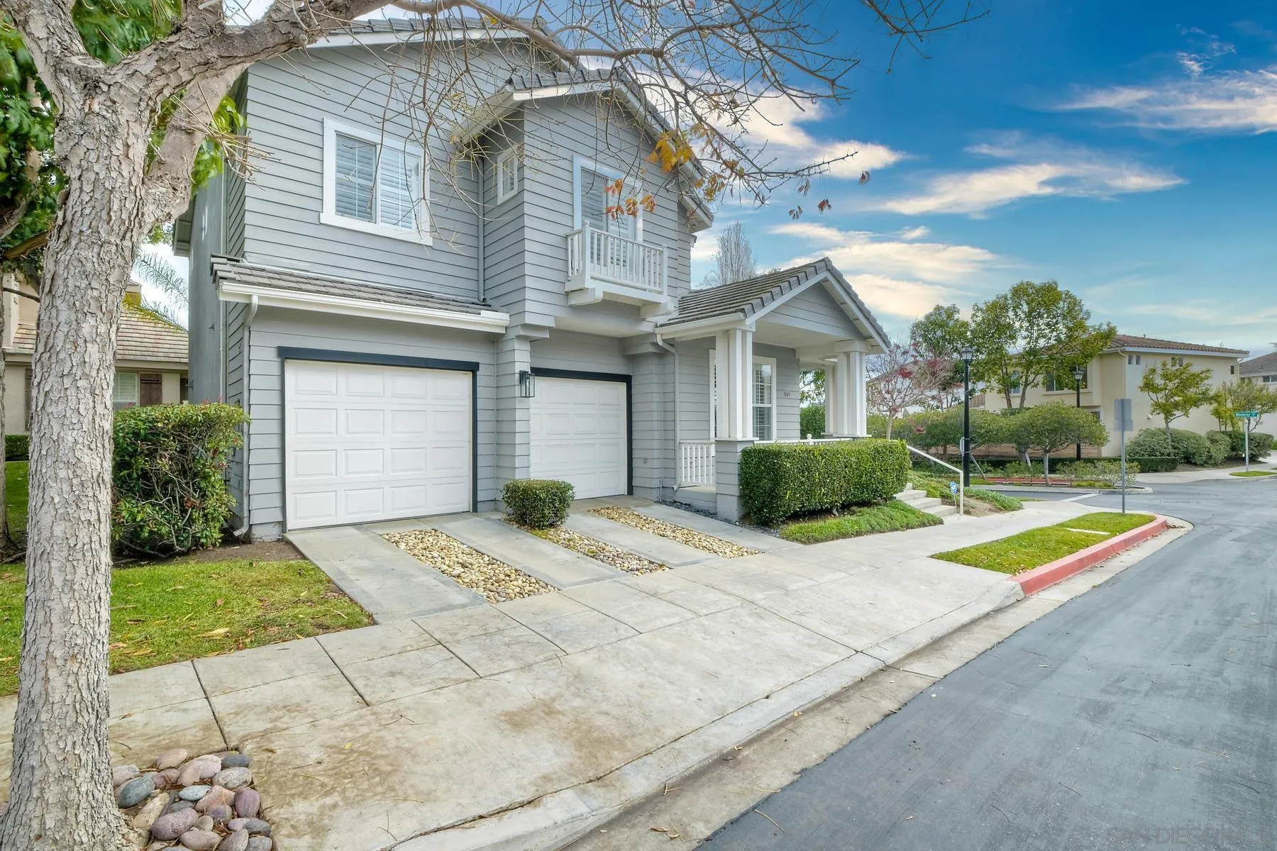1145 Monterey Place Encinitas, CA 92024 - Photo 3 of 34 a view of a white house with a yard and plants