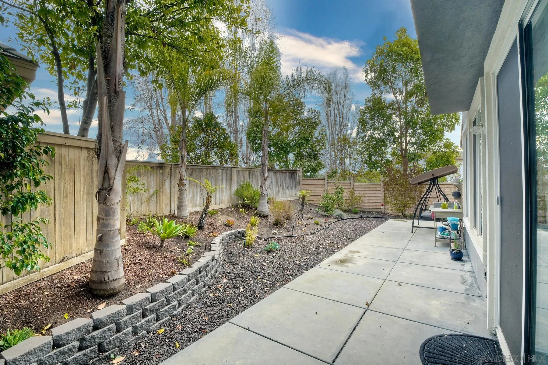1145 Monterey Place Encinitas, CA 92024 - Photo 31 of 34 a backyard of a house with lots of green space and fountain