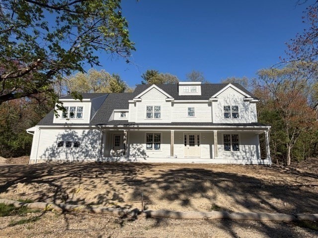 26 Valley Road Dover, MA 02030 - Photo 3 of 7 a front view of a house with a small yard