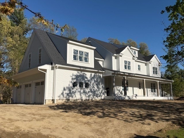 26 Valley Road Dover, MA 02030 - Photo 4 of 7 a front view of a house with a yard