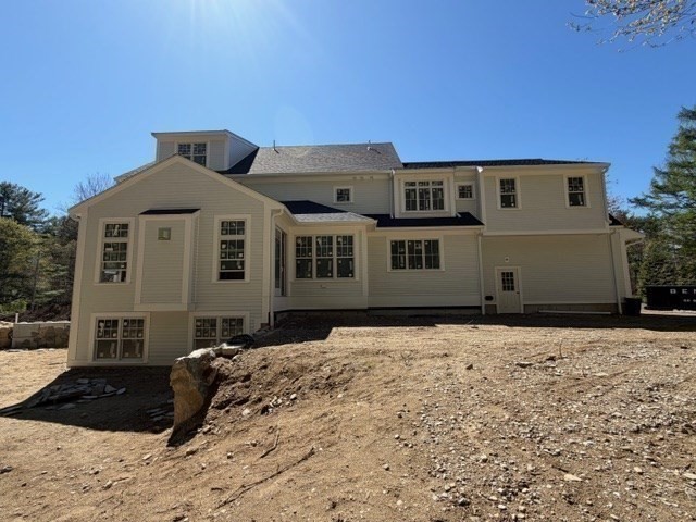 26 Valley Road Dover, MA 02030 - Photo 5 of 7 a front view of a house with a yard