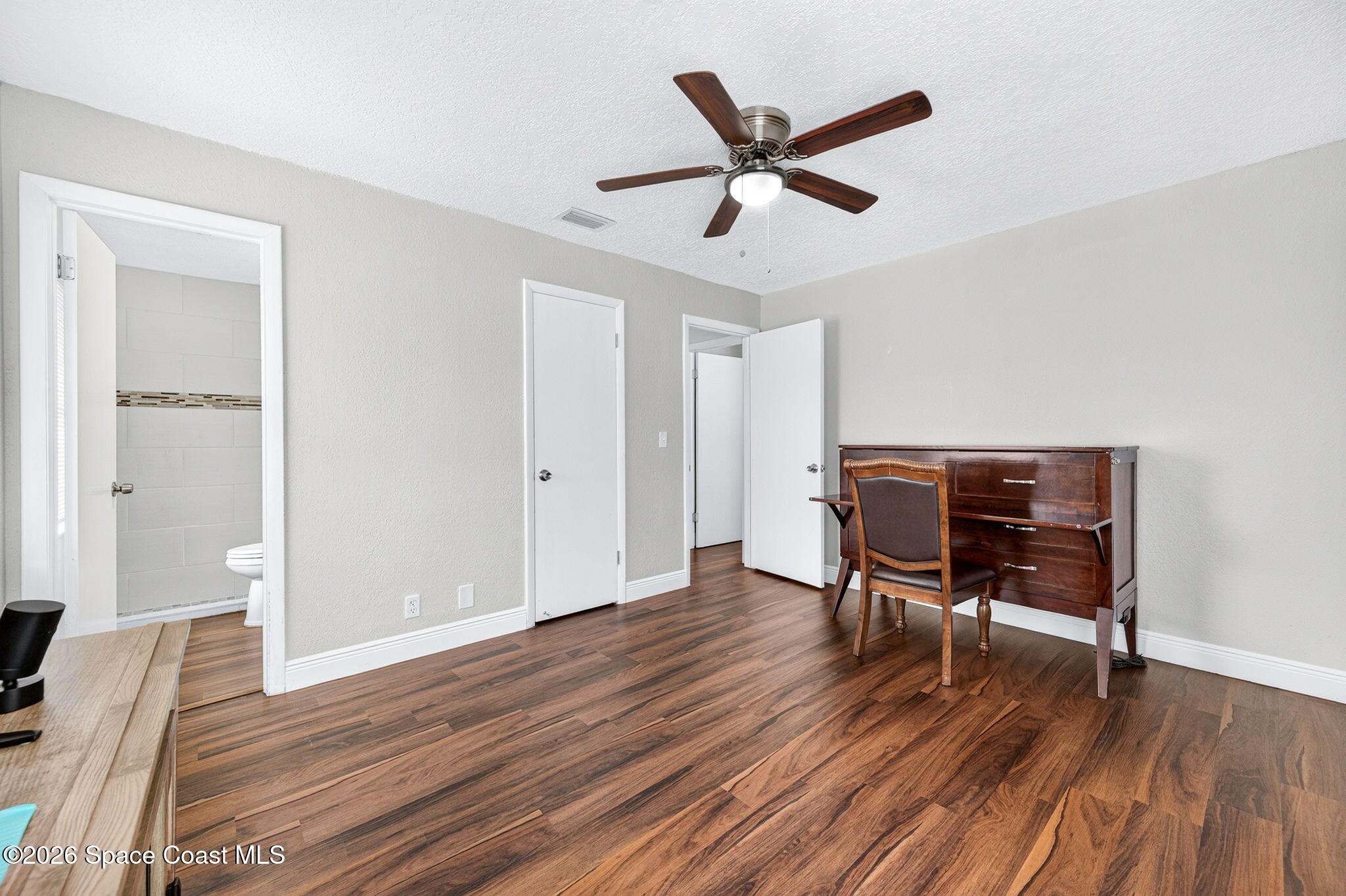 996 Botany Lane Rockledge, FL 32955 - Photo 22 of 35 a view of a livingroom with furniture and wooden floor