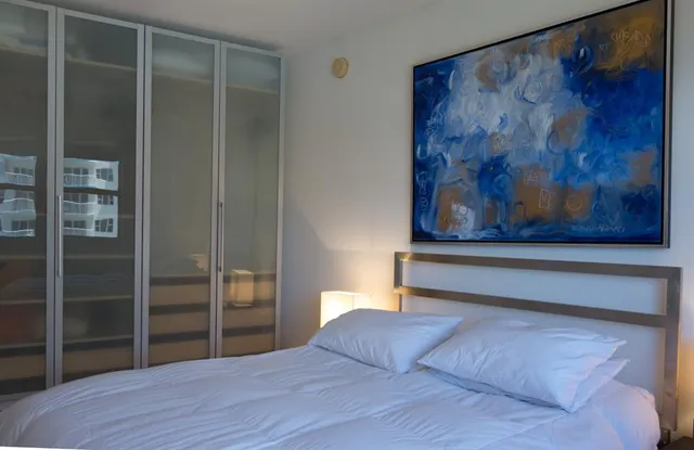 a bathroom with a sink a shower and a mirror