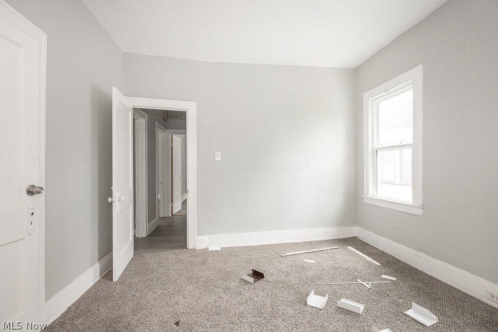 1000 Eddy Road Cleveland, OH 44108 - Photo 34 of 38 Carpeted spare room featuring baseboards