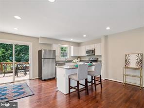 14727 McKnew Road Burtonsville, MD 20866 - Photo 3 of 20 a dining room with furniture and wooden floor