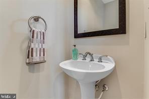 14727 McKnew Road Burtonsville, MD 20866 - Photo 9 of 20 a bathroom with a sink and a mirror