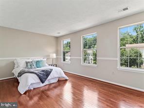14727 McKnew Road Burtonsville, MD 20866 - Photo 10 of 20 a bedroom with furniture and a large window