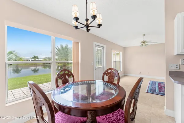 a view of a dining room with furniture window and outside view