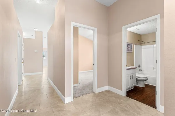 a view of a bathroom from a hallway