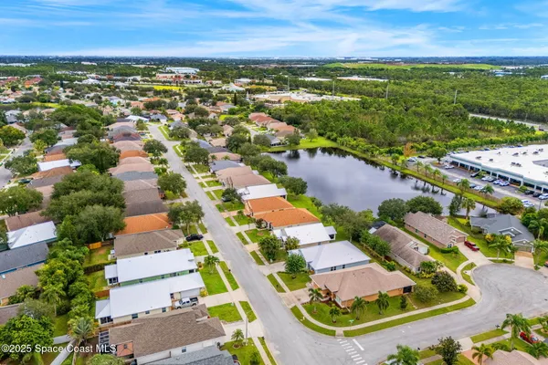 an aerial view of residential houses with outdoor space