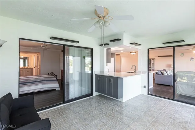 a view of kitchen with refrigerator and cabinets