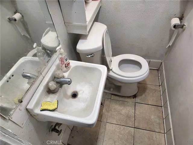 a bathroom with a toilet and a sink