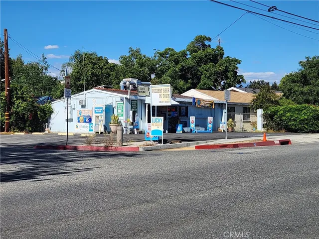 a front view of a building with small garden