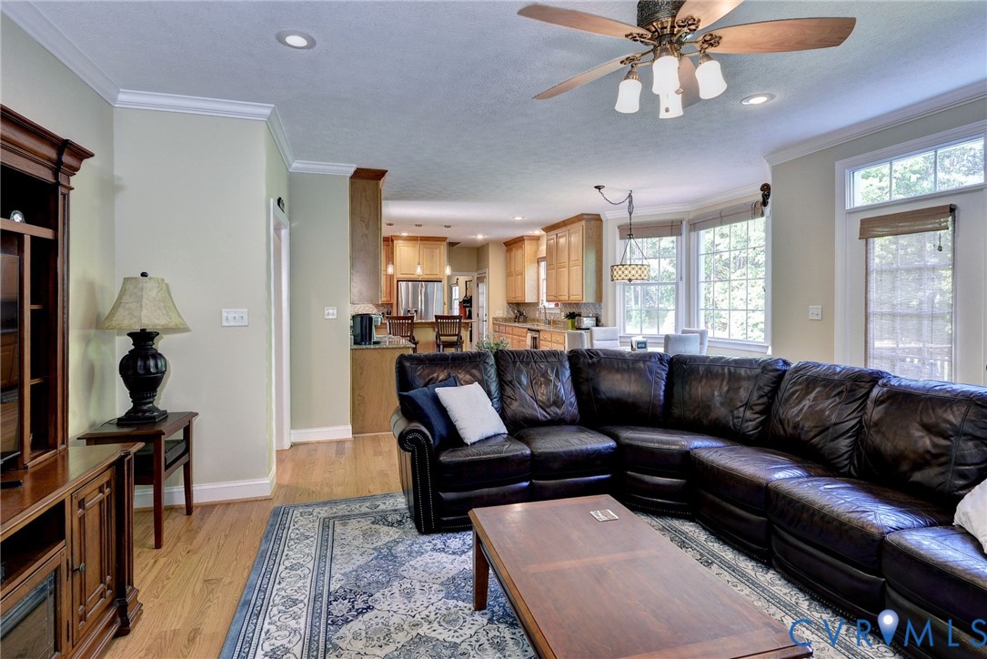 4015 Cold Spring Road Williamsburg, VA 23188 - Photo 12 of 57 Spacious living area featuring wood-finish floorin