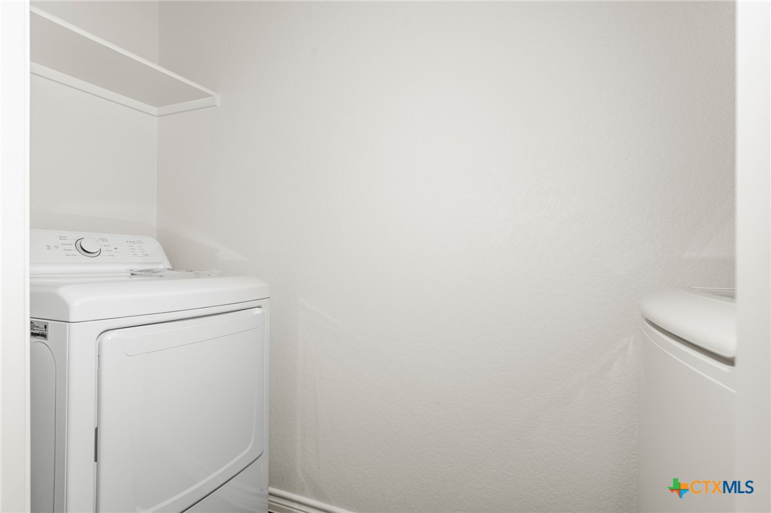 5221 Rose Gdn Loop Killeen, TX 76542 - Photo 14 of 29 a utility room with dryer and washer