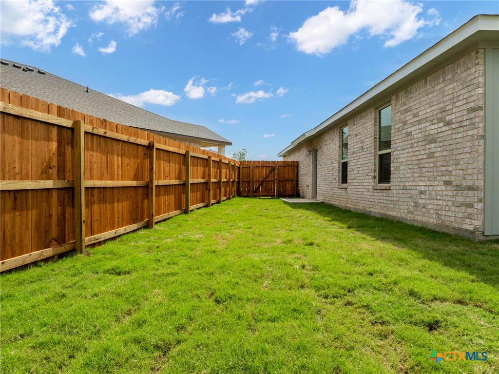 5221 Rose Gdn Loop Killeen, TX 76542 - Photo 26 of 29 a view of a backyard with wooden fence