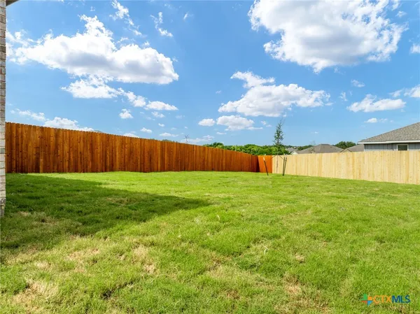 a view of yard with entertaining space