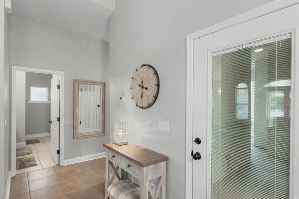 a room with a door and a mirror