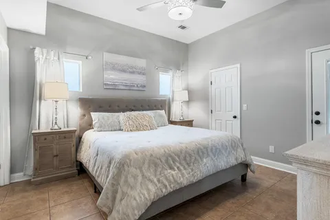 a bedroom with a bed and a lamp